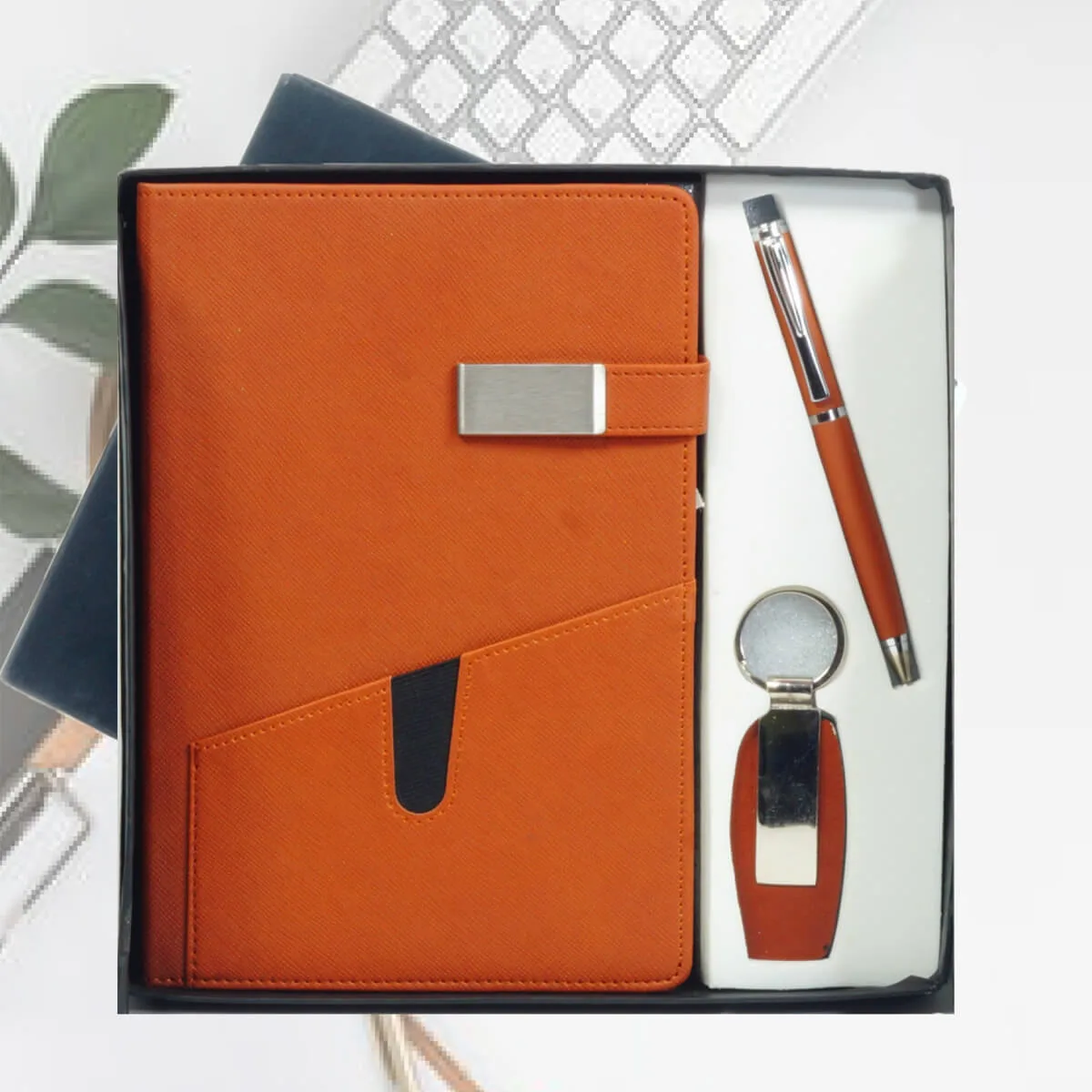 Gift Set Combo 3 in 1 2 Gift Set Combo 3 in 1 orange color with logo engraved on all Dairy, pen, and Keychain