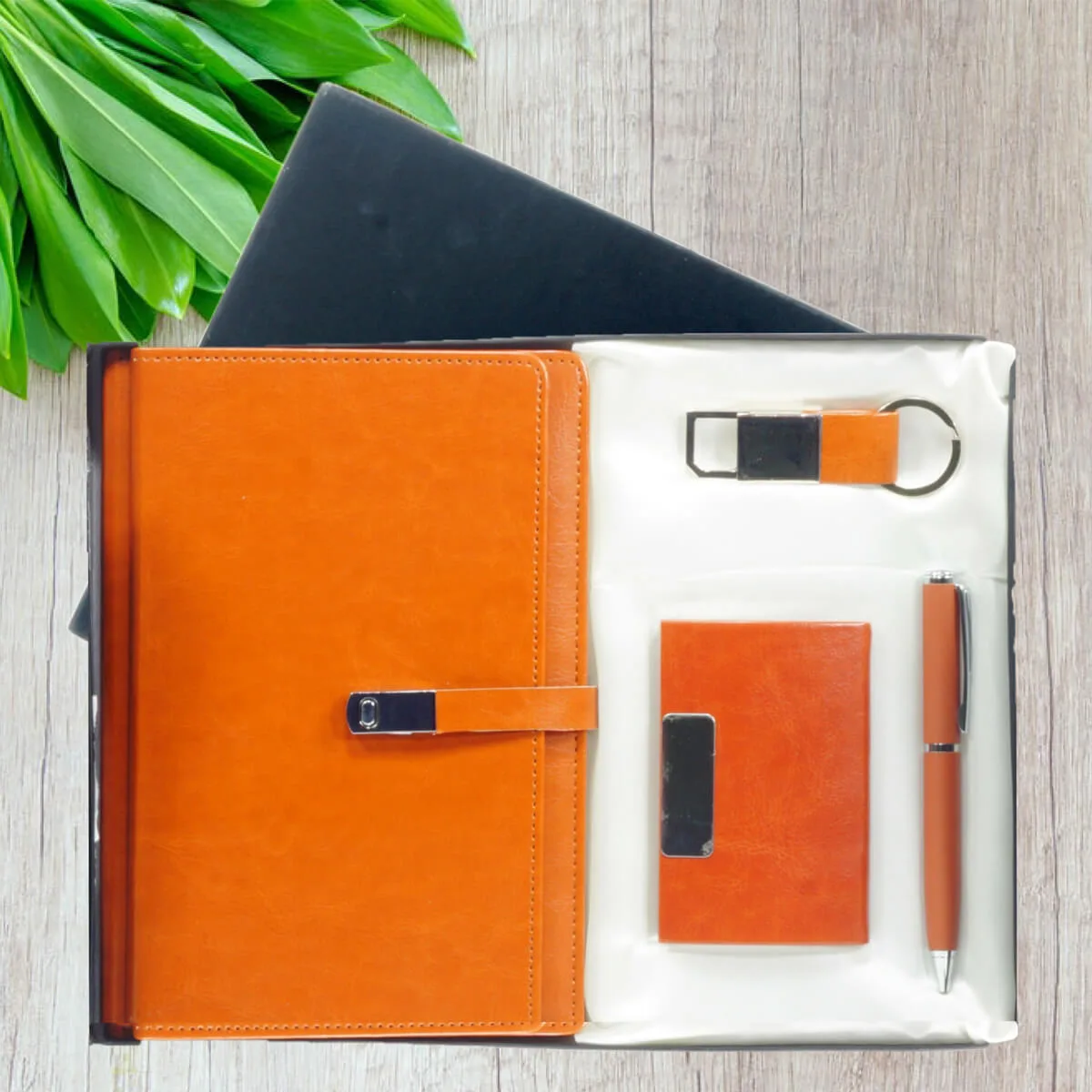 Gift Set Combo 4 in 1 4 Gift Set Combo 4 in 1 Tan color with logo engraved on all Dairy, pen, Keychain, and Card Holder