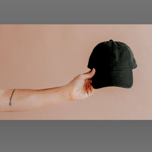 Customize a black color cap in a hand